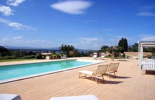 Isola Villa | Experience Villa Gialla: Poolside Bliss Near Sandy Shores