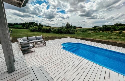 Miłki House | Idyllic Poolside Retreat in Rydzewie with Ocean Views