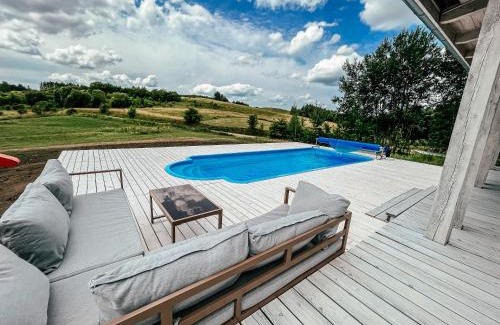 Miłki House | Idyllic Poolside Retreat in Rydzewie with Ocean Views