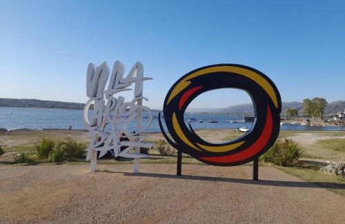 Villa Carlos Paz House | Relax at Sierras Del Sol with Oceanfront Views and Pool