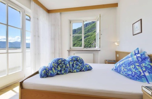 Andriano Apartment | Unforgettable Sigmundskron: Pool, Lake Views & Spa Retreat