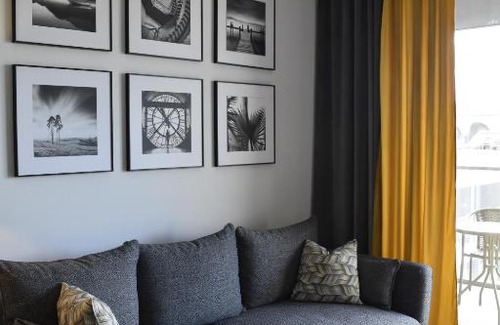 Witomino Apartment | Modern Silver Apartment Tower: Family-Friendly Retreat