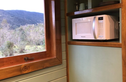Praia Grande Ski Chalet | Unique Silver Coin Tiny House with Canyon Views