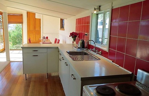 Dennes Point Cottage | Simple cottage with charm, character and exceptional views