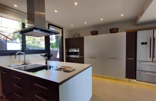 Sitges Villa | ```html
Seaside Getaway: Spacious Villa with Private Pools
```