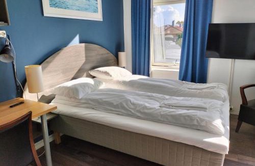 Kristiansand Hotel | Comfortable Stay at Sjøgløtt Gjestgiveri with Family Amenities