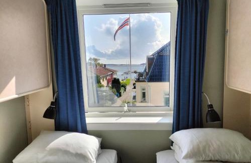 Kristiansand Hotel | Comfortable Stay at Sjøgløtt Gjestgiveri with Family Amenities
