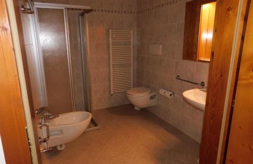 San Martino di Castrozza Apartment | Inviting Ski Residence with Hot Tub & Breakfast Options