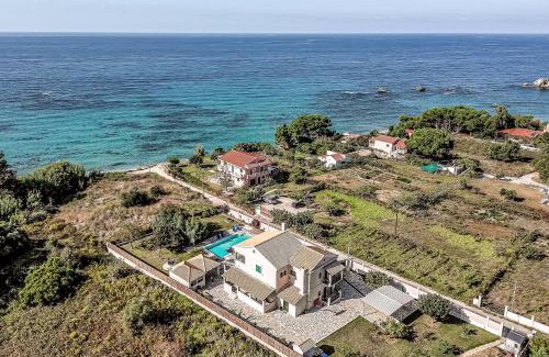 Agios Matthaios House | Stunning Skidi Beach House with Oceanfront Pool & Views