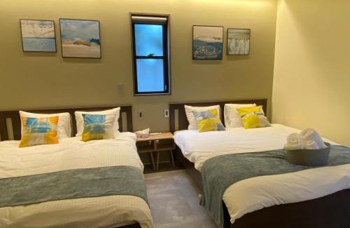 Yomitan Villa | Family-Friendly Sky Blue Villa沖縄 with Relaxing Hot Tub