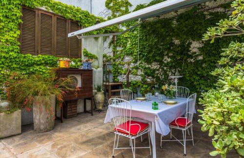 Ciudad Vieja Apartment | Sky Garden Sarandi: Poolside Relaxation & Barbecue Bliss