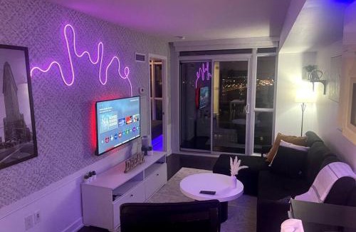 CityPlace Apartment | Relax at SkyHigh Haven: LED-Lit Downtown Condo Escape