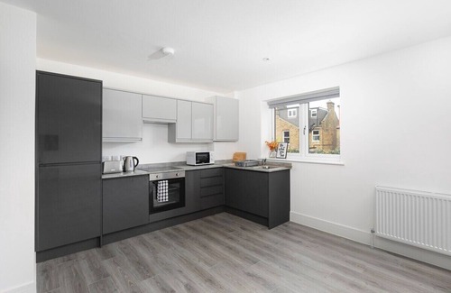 Enfield House | Cozy 1-Bedroom Retreat with Balcony at Skyvillion
