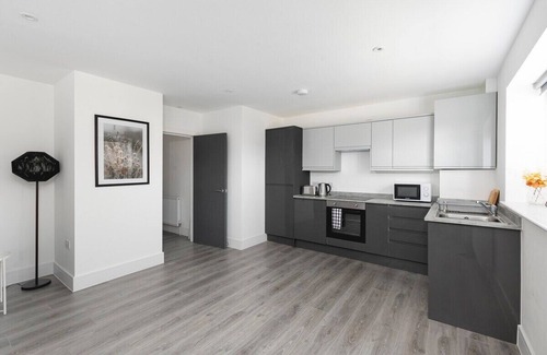 Enfield House | Cozy 1-Bedroom Retreat with Balcony at Skyvillion