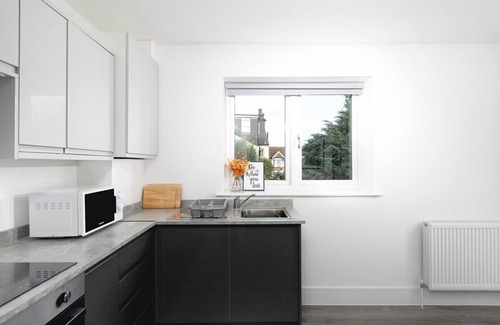 Enfield House | Cozy 1-Bedroom Retreat with Balcony at Skyvillion