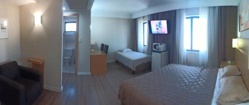 Guarulhos City Centre Apartment | Experience Slaviero1808: Oceanfront Retreat with Pool