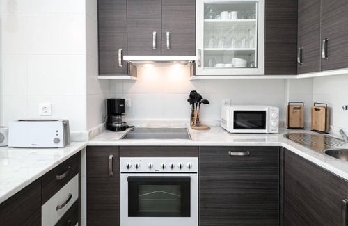 Manilva Apartment | Unwind at Small Oasis: Sea View with Pool & Spa Access