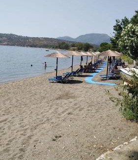 Karvelas Apartment | Idyllic Escape at Small Paradise in Kamares: Oceanfront Bliss