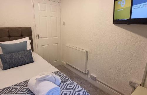 Port Talbot House | Modern 4-Bed House with TVs in Every Room for Families
