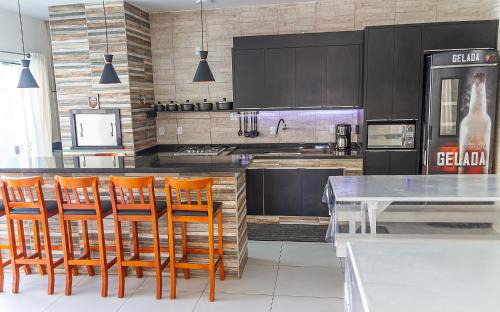 Enseada House | Inviting Retreat with Heated Pool Steps from the Beach