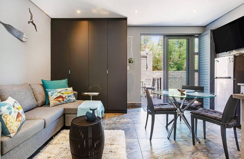 Camps Bay Apartment | Eco-Friendly Retreat with Oceanfront Views and Terrace