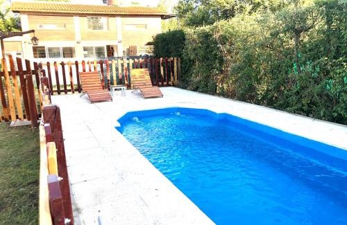 Villa General Belgrano House | Pet-Friendly Sonnen Haus: 4-Star Stay with Pool Access