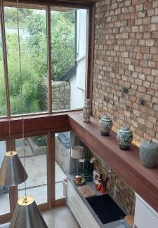 Sutton Apartment | Sophisticated Seafront 3BD Suntrap Landscaped Yard