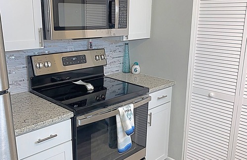 Mary Esther Condo | Soundside 2 Bedroom Condo - Pool & fishing dock