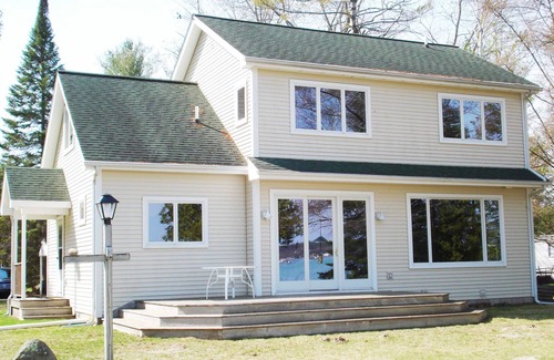Alden House | Beachfront Bliss at Torch Lake with Scenic Ocean Views