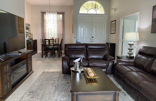 Central Naples House | Lake View Retreat with Heated Saltwater Pool & Tesla Charging