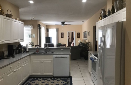 Central Naples House | Lake View Retreat with Heated Saltwater Pool & Tesla Charging