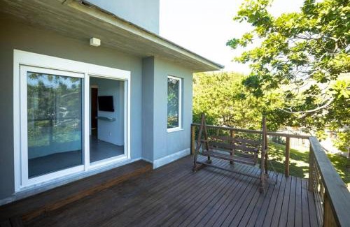 Garopaba House | Relaxing Spa Retreat with Oceanfront Views and Suites