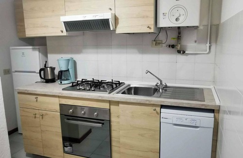 Porto Valtravaglia Apartment | Inviting 2-Room Apartment with Expansive Garden & Spa