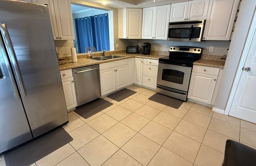 Oakland Hills House | Spacious 4/2 with heated pool and lake view FREE GOLF! Close to gulf beaches!