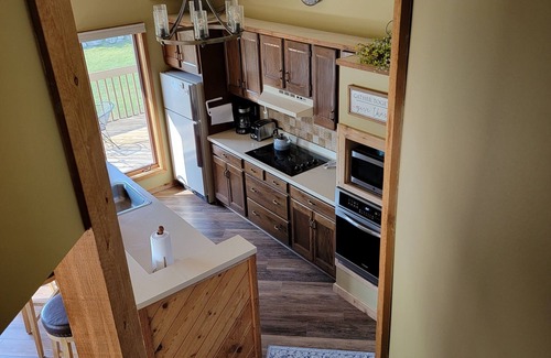 Mancelona Condo | Spacious 2-Bedroom Retreat with Pool & Hot Tub Near Lakes