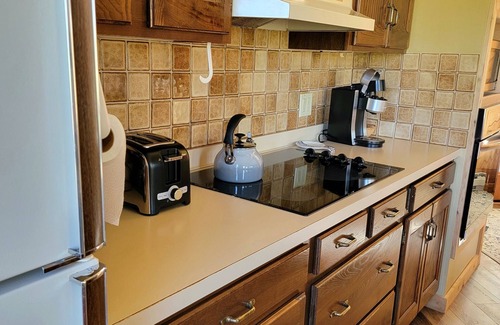 Mancelona Condo | Spacious 2-Bedroom Retreat with Pool & Hot Tub Near Lakes