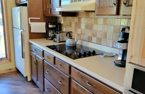 Mancelona Condo | Spacious 2-Bedroom Retreat with Pool & Hot Tub Near Lakes