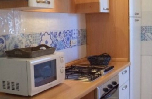 Lido di Capoliveri Apartment | Bright Apartment Steps from the Beach with Spa & Breakfast