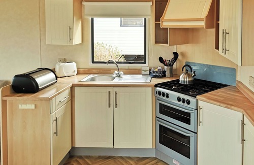 Llanllwchaiarn House | Welcome to Your 12ft-Wide Oceanfront Caravan Retreat