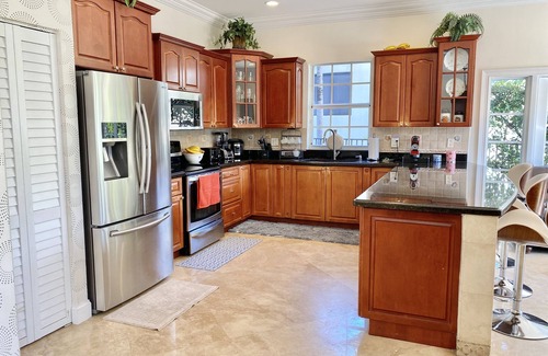 Garden Isles House | Beautiful 4-Bedroom Retreat with Heated Pool & Ocean View