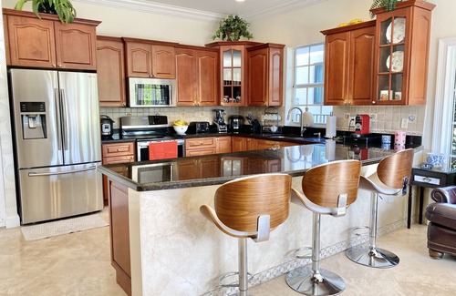 Garden Isles House | Beautiful 4-Bedroom Retreat with Heated Pool & Ocean View