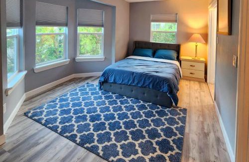 Lake Underhill House | Inviting Bedroom with Private Workspace and Ensuite Bathroom