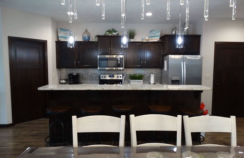 Arnolds Park Cabin | Idyllic Bridges Bay Poolside Cabin with Ocean View Amenities