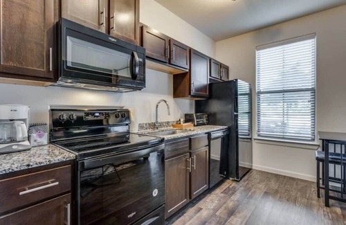 McNeil Apartment | CozySuites on I-35: Pool Access & Family-Friendly Amenities
