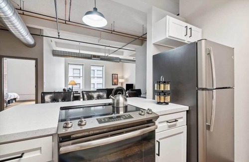 Downtown Kansas City Apartment | Inviting Downtown Retreat with Pool, Gym & Family Amenities
