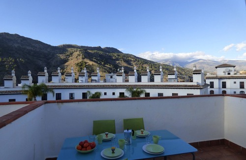 Velez de Benaudalla Apartment | Inviting Duplex with Roof Terrace & Ocean Views