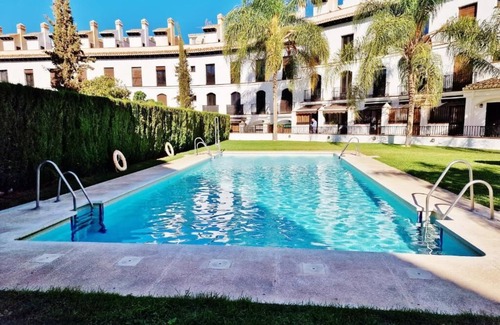 Velez de Benaudalla Apartment | Inviting Duplex with Roof Terrace & Ocean Views