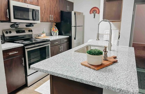 South Side Apartment | Inviting 2-Bedroom Retreat Nestled Among Shaded Oaks