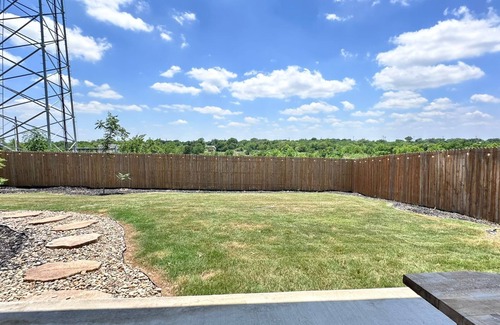 Buda House | Spacious home near Austin with a large backyard perfect for enjoying sunsets.