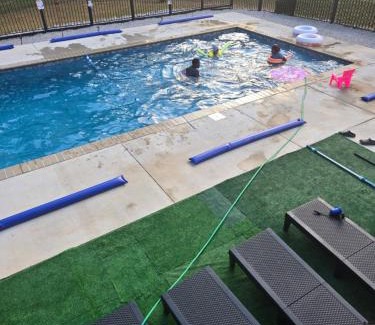 Greensboro Apartment | Spacious Kingbed 3b2b Apt with stairs sleeps 7 pool and grill
